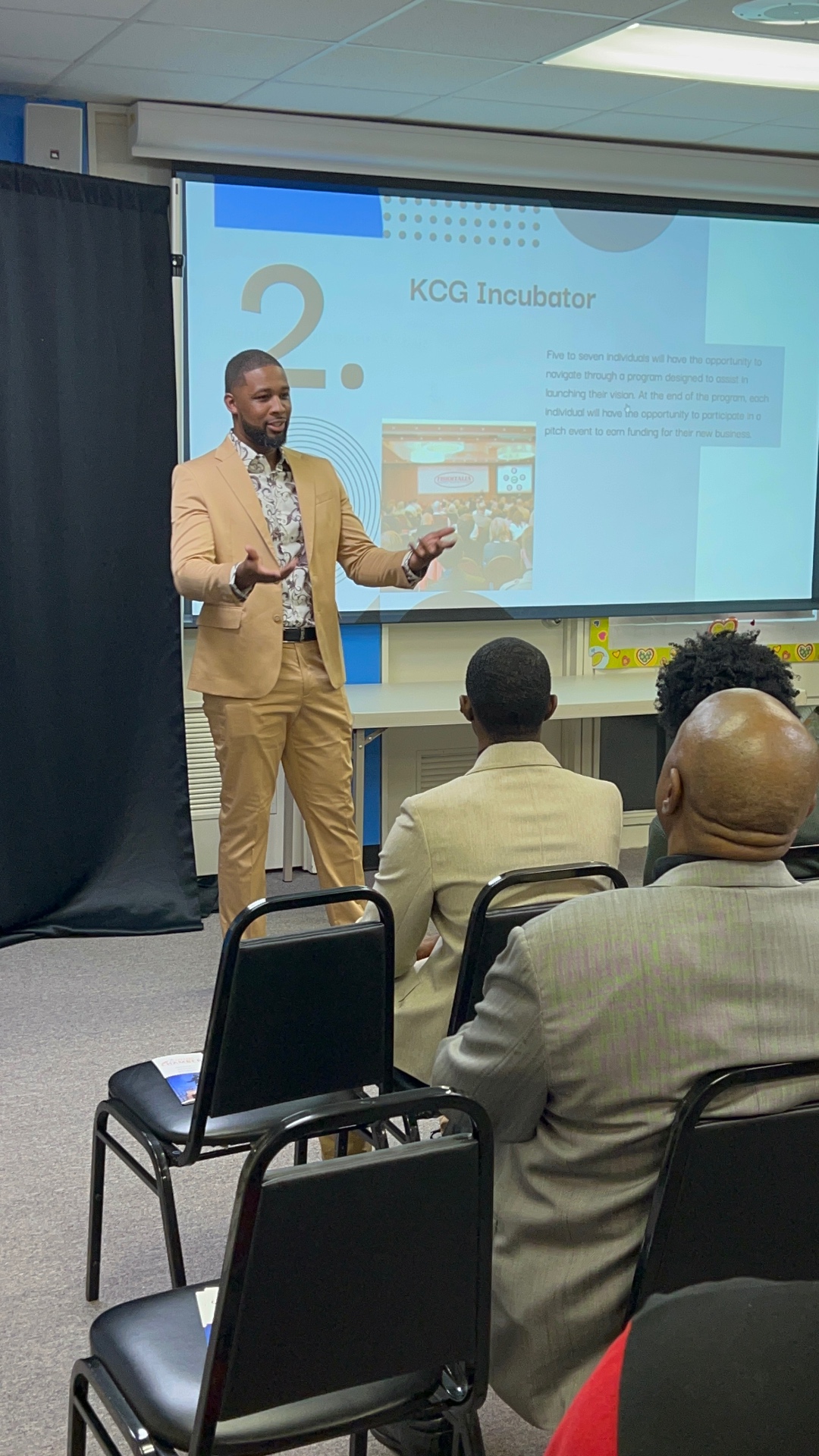 Xavier DeBrough presenting at a conference